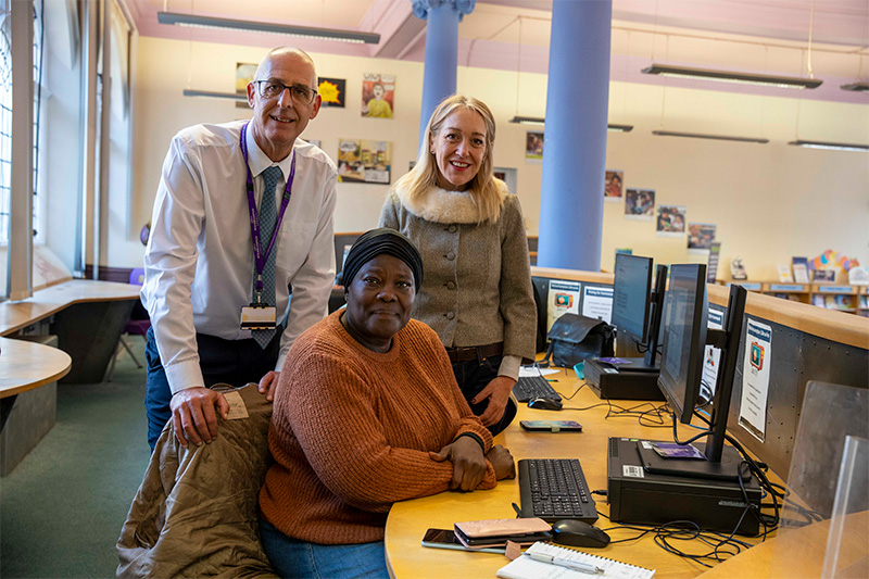 (L-R): Duncan Fellow, Assistant Librarian, Jennifer Iqboinovia, learner, and Councillor Jeszemma Howl, Cabinet Member for Governance and Digital, at a digital drop-in session, at Central Library, Wolverhampton